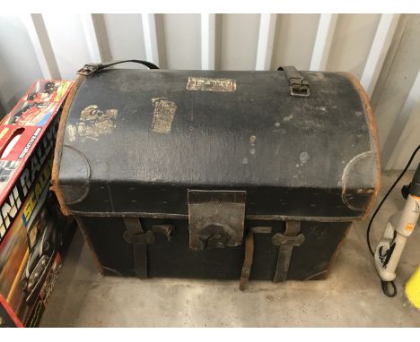 A Victorian leather-trimmed and Japanned canvas covered wicker travel trunk, with inner tray, the lid bearing a printed paper