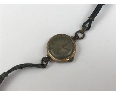A lady's vintage gold-cased wristlet watch