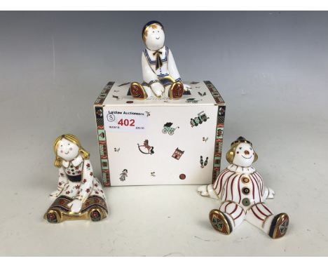 Two Royal Crown Derby 'Treasures of Childhood' figurines; Fleur and Ragdoll Sailor together with a Royal Crown Derby Stripy C