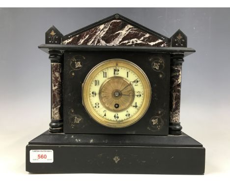 A Victorian black slate mantel clock