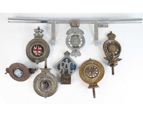 A collection of six various RAC cast metal car badges, some with enamel detail; together with a chromed metal car badge bar, 