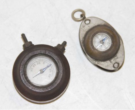 A miniature pocket compass, with inset loup, together with a miniature dashboard(?) compass (2)