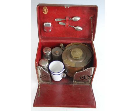 A tan leather En Route travel tea/picnic case, containing a copper kettle with burner, milk and sugar bottles, two enamel cup