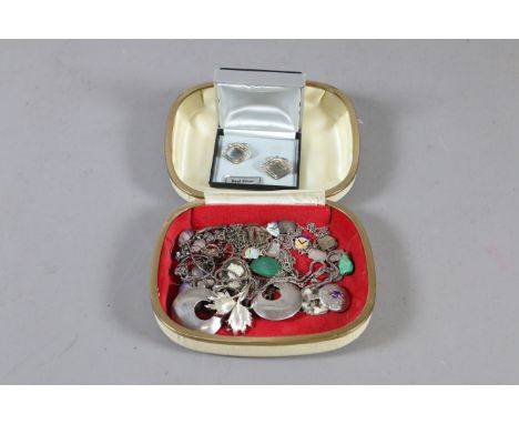 A box of silver jewellery to include cufflinks and pendants along with a abalone shell cameo brooch, enamel charms etc.