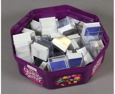 A box of ring boxes with clear perspex tops.