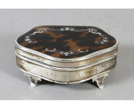 A George V silver and tortoise shell ring box, raised on scroll feet assayed Birmingham 1925.