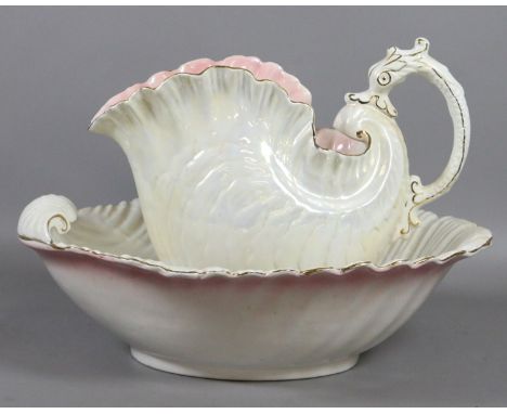 An irridescent jug and bowl formed as conche shells.