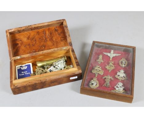 A small framed collection of British Paratrooper cap badges and a yew wood box containing similar collectables; cap badges, t