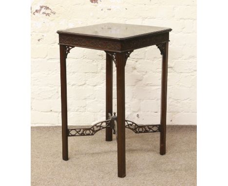 A mahogany Chippendale style occasional table with fret carved cross stretcher.