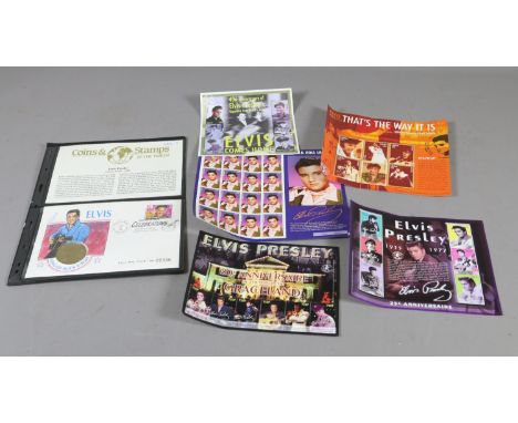 A collection of Elvis memorabilia to include a Limited Edition First Day Cover and a five dollar coin along with a collection