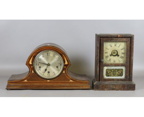 An Edwardian mahogany cased eight day Westminster mantel clock with mother of pearl inlay along with an American postmans ala