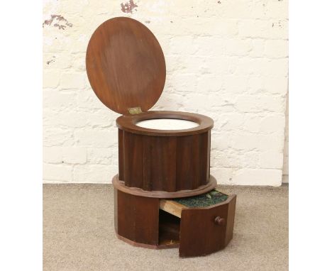 A Victorian mahogany step commode formed as a reeded column with original creamware liner.