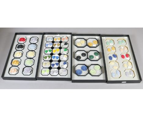 Four display trays of resin bonded earrings, brooches and stick pins etc.