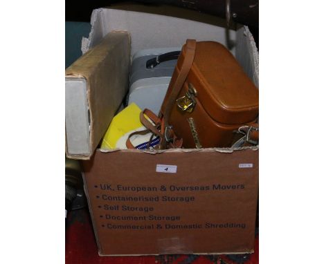 A collection of photographic equipment to include Seconic 8mm camera, projector, film reels, binoculars and accessories.