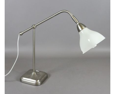 An adjustable desk lamp with brushed metal base.