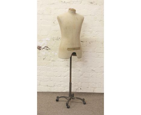 A vintage dressmakers mannequin on metal stand.