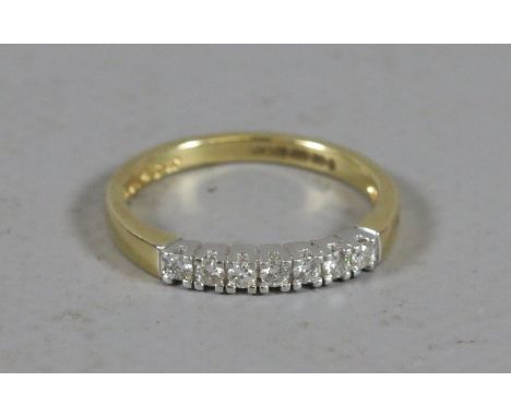 A ladies 18ct gold seven stone diamond ring, size P.