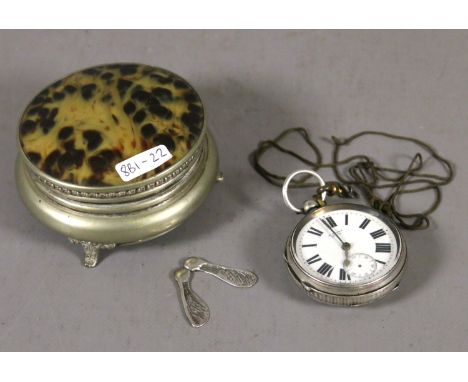 A silver fusee pocket watch assayed Chester 1900 along with a white metal sycamore seed trinket and a tortoise shell trinket 