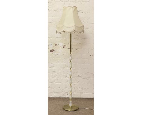 A brass and onyx standard lamp.