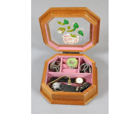 A jewellery box containing ladies wristwatches, a childs Hopalong Cassidy watch and swatch example.