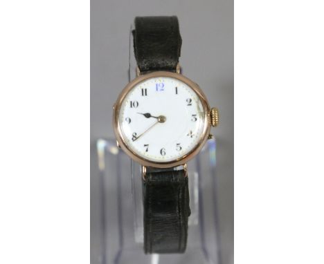 A vintage 9ct gold cased gentleman's manual wristwatch with enamel dial and Arabic numeral markers, engraved with a script cy
