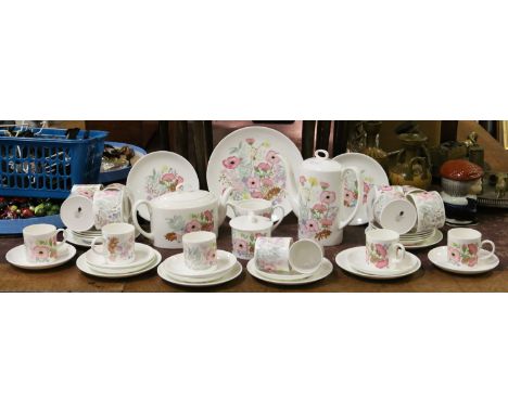 A Wedgwood tea and coffee service decorated in The Meadow Sweet pattern comprising teapot, coffee pot, bread and butter plate