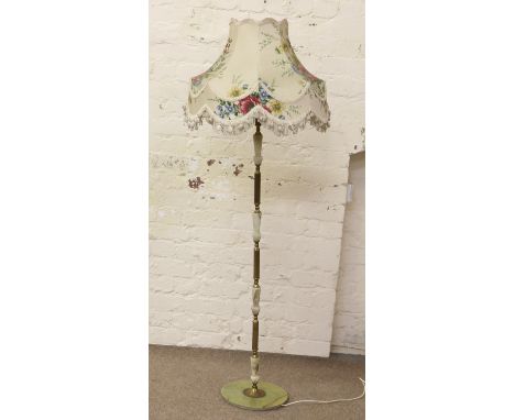 A brass and onyx standard lamp.