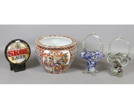 A modern Oriental planter, two art glass baskets and a Skol lager bar advertising sign.