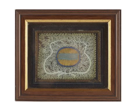 A FRAMED PIECE OF BLUE RIBBON OF JACOBITE INTERESTCONTAINED WITHIN A FRAME, SURROUNDED BY A DECORATIVE FOLIATE CUT PAPER DESI