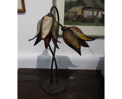 A bronzed and stained glass Deco style two sconce table lamp