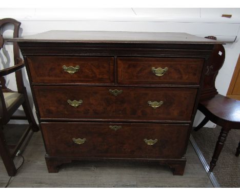 An early 18th Century oak and burr walnut chest of two short over two graduating long drawers on bracket feet, 89cm x 101cm x