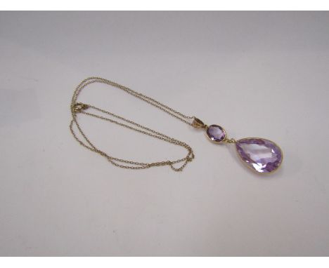 An amethyst double drop pendant stamped 9ct, hung on chain, 52cm long, 4cm drop, 4.7g total