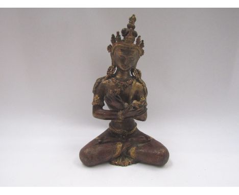 Nepalese Deity, Mid 19th Century, central ruby cabochon, 20cm tall 