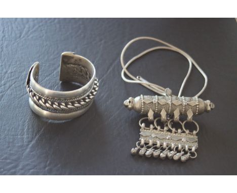 A silver Bedouin bracelet , Egypt or Jordan together with an etnic silver necklage.   First half of the 20th Century.        
