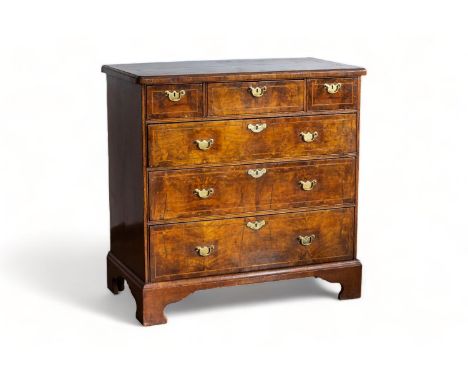 An English George I walnut chest with three short and three long graduated drawers, first half 18th Century   The chest with 