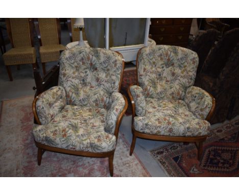 A pair of Ercol mid stain cottage arm chairs
Chairs are approximately 71cm long x 66cm wide x 79cm tall&nbsp;