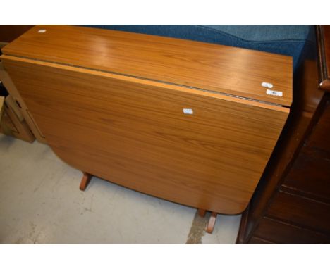 A vintage laminate gateleg kitchen table