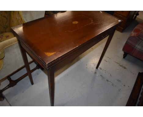 A reproduction Edwardian style fold over card table