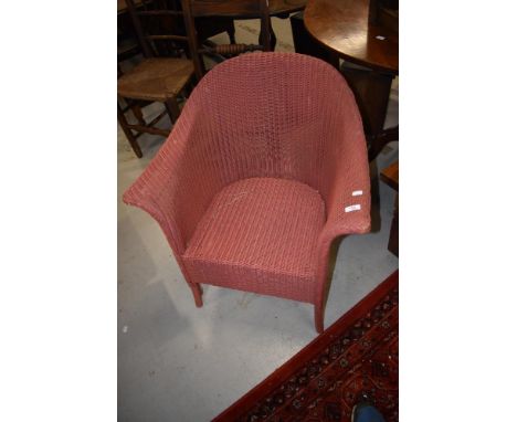 A vintage Lloyd Loom tub chair