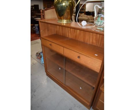 A Nathan side bookshelf with open shelf over two drawers, glass fronted shelves under