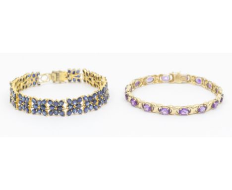 An amethyst  and 14k gold bracelet, compriing alternate oval mixed cut amethysts each approx 6x5mm, and alternate cross like 
