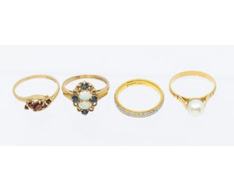 A collection of four stone set 9ct gold rings, to include a continental gold and cultured pearl set ring, size N1/2, marked t