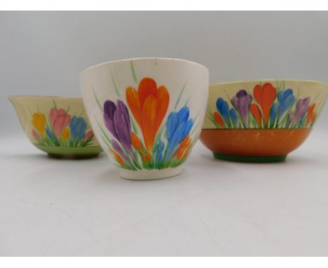 Three Clarice Cliff porcelain bowls comprising of a Crocus pattern bowl together with a Spring pattern bowl and a Wilkinson C