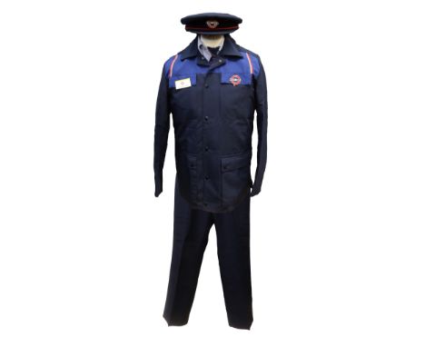 A man's late 1960s/early 1970s London underground suit comprising of a jacket with button fastening in navy with a lighter ro