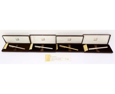Dunhill; three silver plated rollerball pens and a gold plated rollerball pen (4)