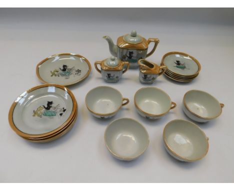 An early 20th Century child's play tea set with Louis Wain style cat detail, incomplete set , damage to 1 cup , see images