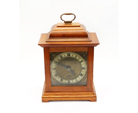 A 1950s Empire 8 day mantle clock with brass square face, Roman numerals, in mahogany case.