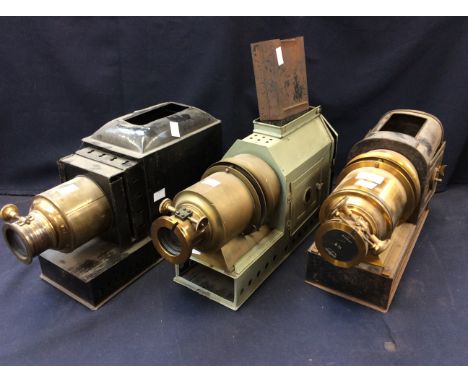 A collection of three early 20th Century tinplate and brass Magic Lanterns, one with maker's label H.J Redding &amp; Co. Lond