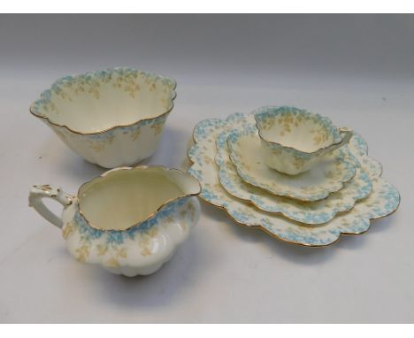 Wileman &amp; Co, Foley - a bone china part tea service including 10 x trios, 2 cups and saucers, milk jug, bowl and plate in