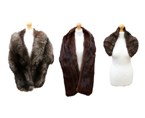 A collection of furs to include a 1940s silver fox fur cape, a shaded musquash stole and a brown mink collar.
